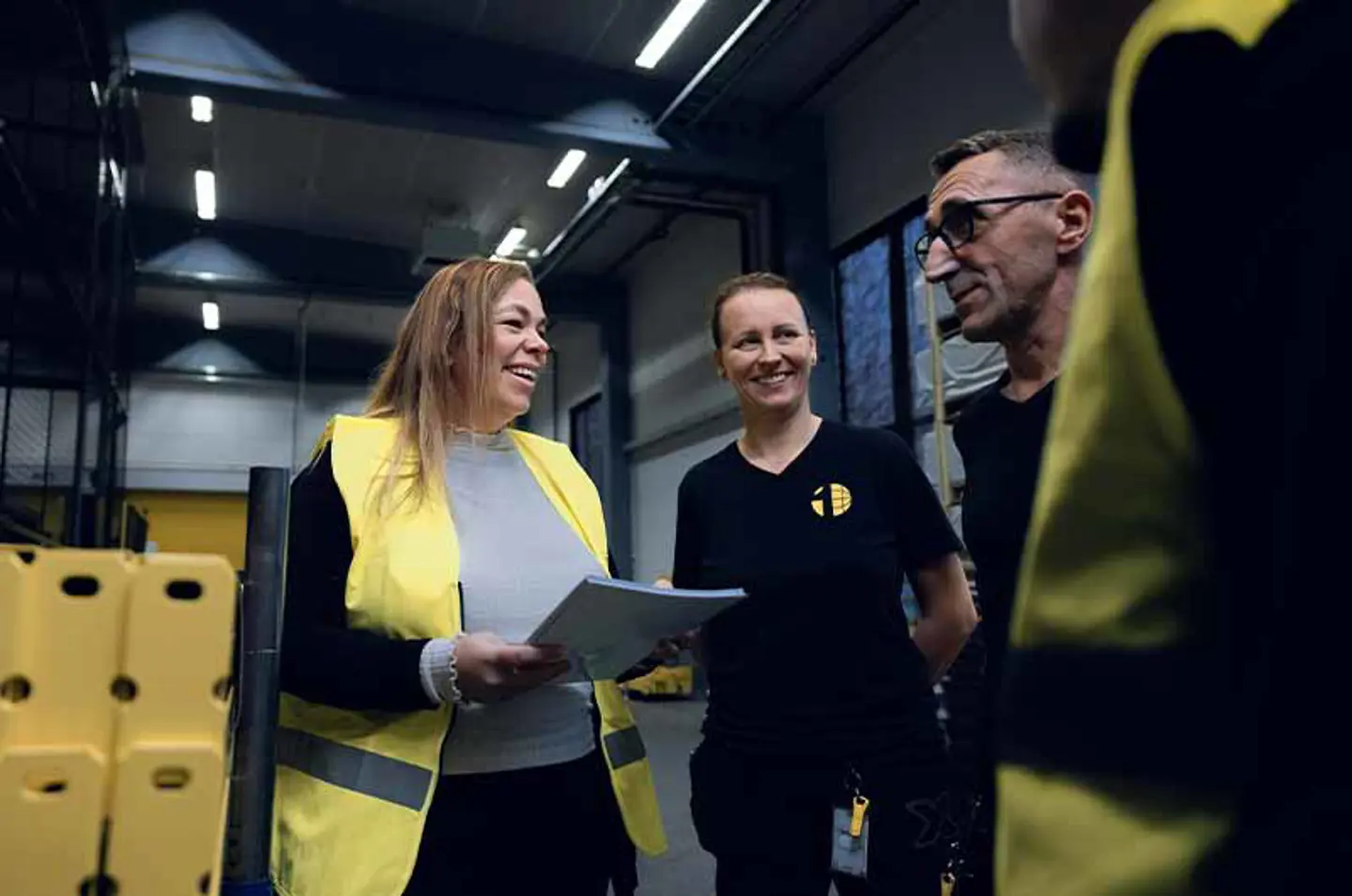 people discussing in warehouse environment